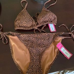 Brand new bathing suit. Size small top and medium bottoms.